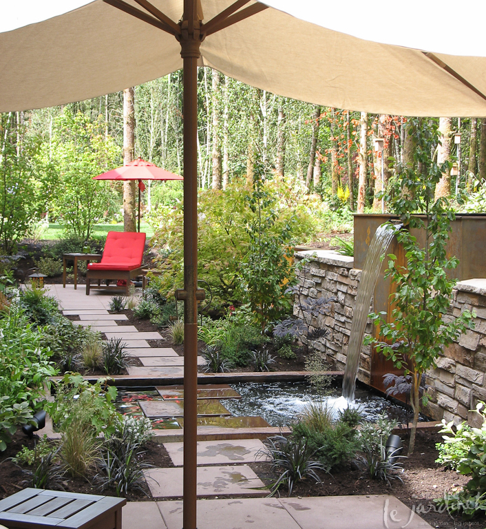 A simple path from one patio to another becomes an adventure as it traverses a shallow pool