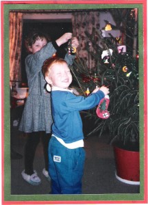 Always the comedian - Paul hangs his own ornament on the tree. 1994