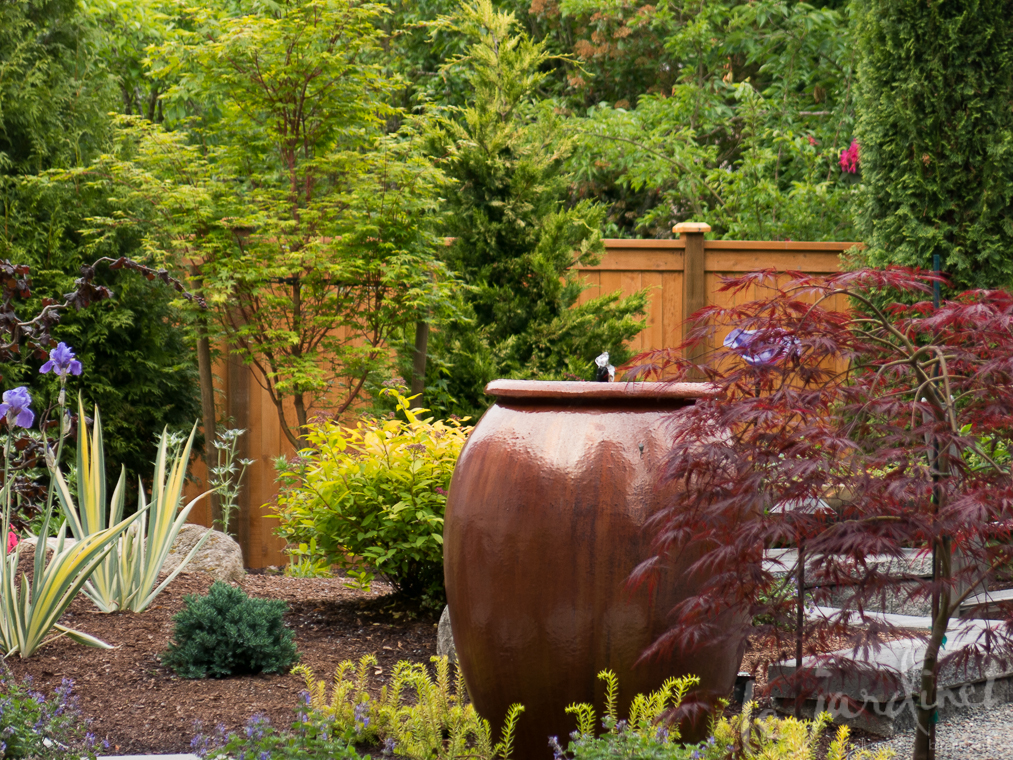 A water feature adds sound and movement to the garden