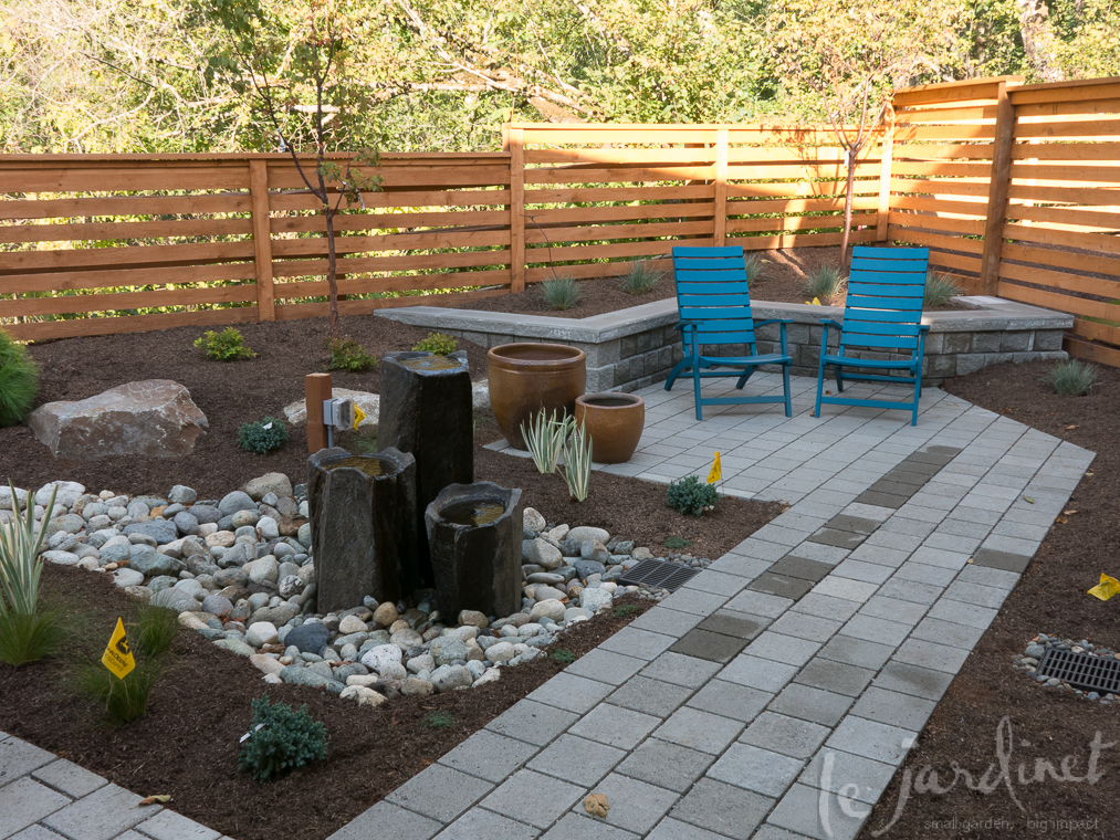 AFTER; a retaining wall takes care of the grade and becomes extra seating around a secondary patio